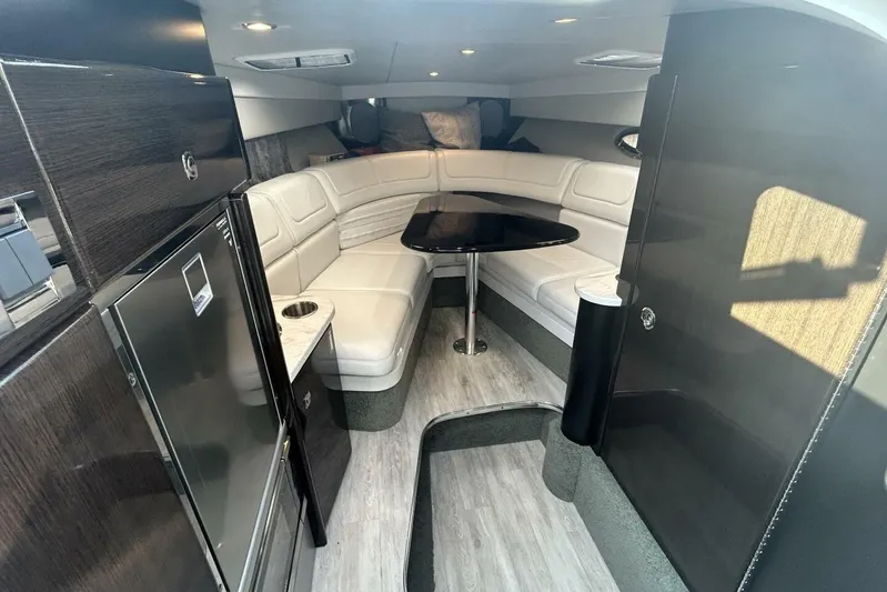  Yacht Photos Pics Luxurious interior of a 2020 Formula 310SS boat with modern seating and table.