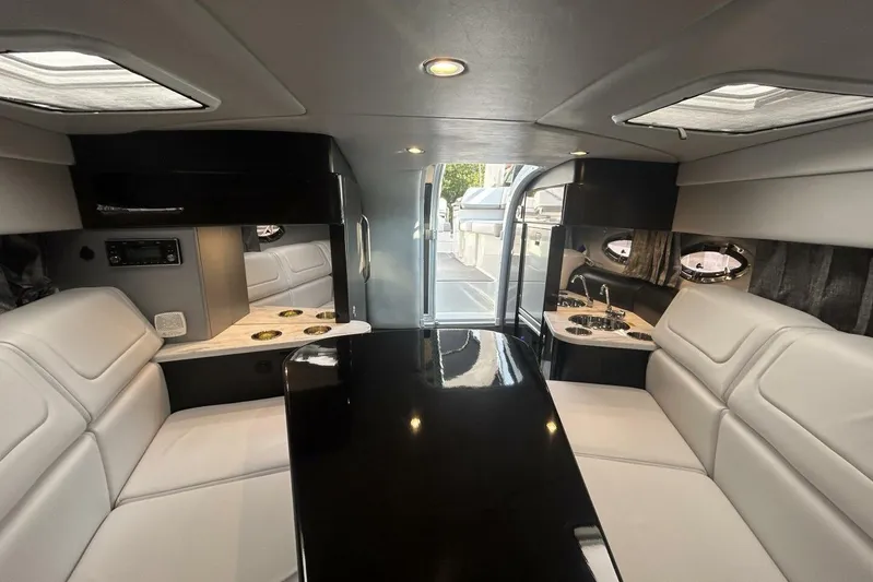  Yacht Photos Pics Luxurious interior of 2020 Formula 310SS boat with sleek seating and modern amenities.