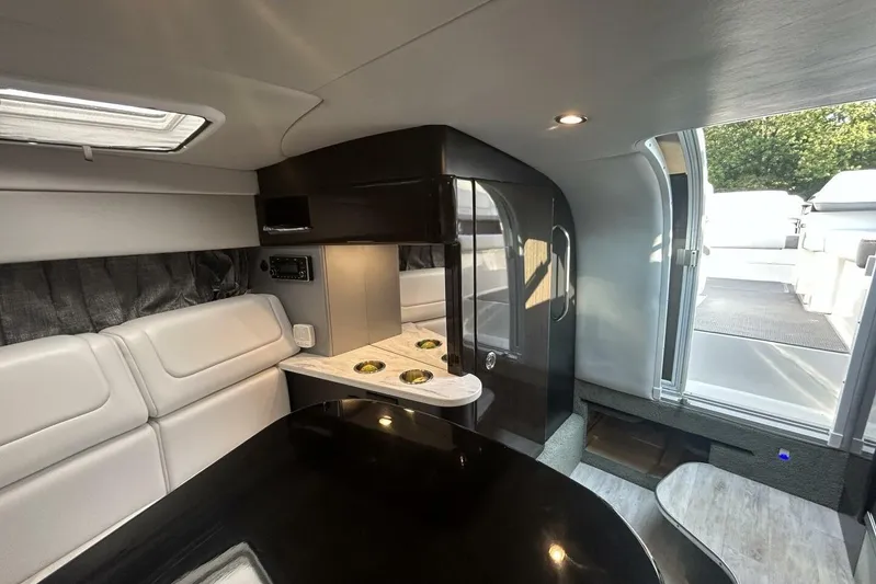  Yacht Photos Pics 2020 Formula 310SS boat interior with modern seating and sleek design.