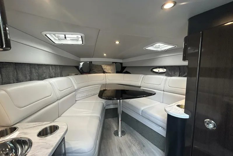  Yacht Photos Pics Luxurious interior of 2020 Formula 310SS boat with white seating and modern design.