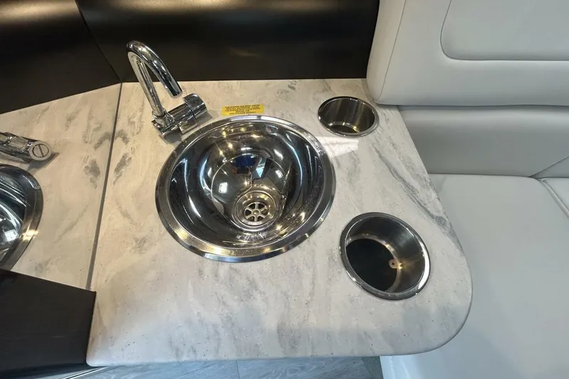  Yacht Photos Pics 2020 Formula 310SS boat interior with stainless steel sink and marble countertop.