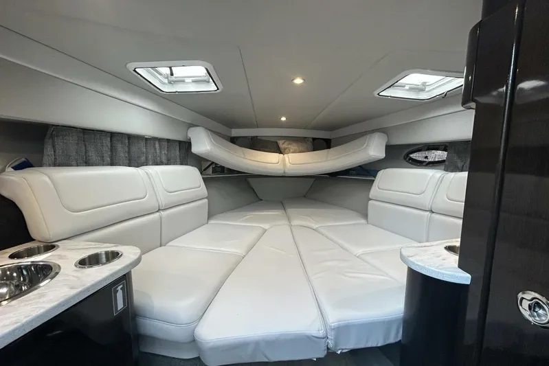  Yacht Photos Pics 2020 Formula 310SS boat interior with white leather seating and modern design.
