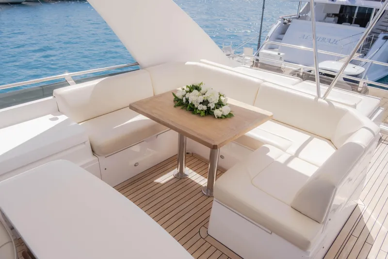  Yacht Photos Pics Luxurious 2008 Princess 62 Flybridge yacht with elegant seating and floral centerpiece.