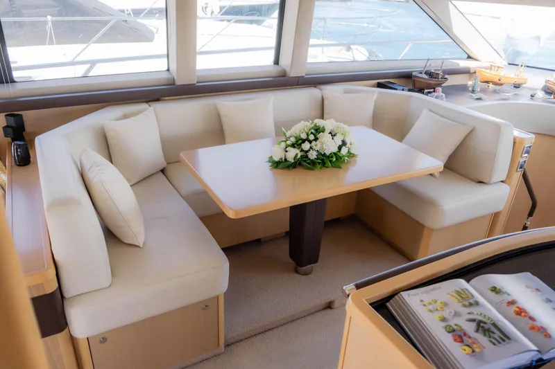  Yacht Photos Pics Luxurious 2008 Princess 62 Flybridge yacht interior with elegant seating and floral centerpiece.