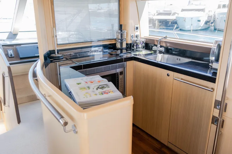  Yacht Photos Pics Luxurious kitchen interior of 2008 Princess 62 Flybridge yacht with modern amenities.