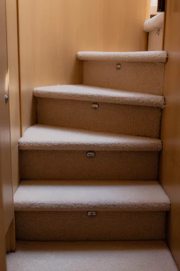  Yacht Photos Pics Carpeted stairs inside 2008 Princess 62 Flybridge yacht.