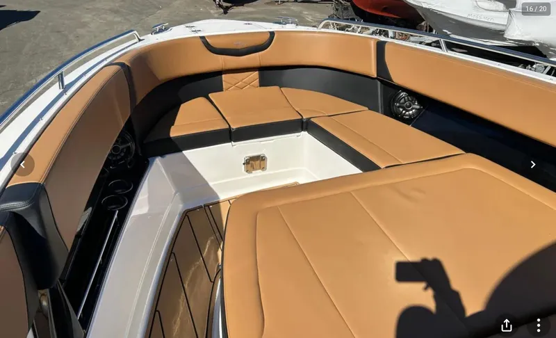  Yacht Photos Pics 2024 Chaparral 300 OSX boat interior with tan leather seating and modern design.