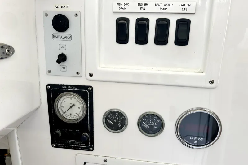 Reel Inn Yacht Photos Pics Control panel of a 2003 Viking 61 Convertible yacht with gauges and switches.