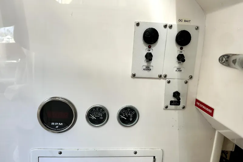 Reel Inn Yacht Photos Pics Control panel of a 2003 Viking 61 Convertible yacht with gauges and switches.