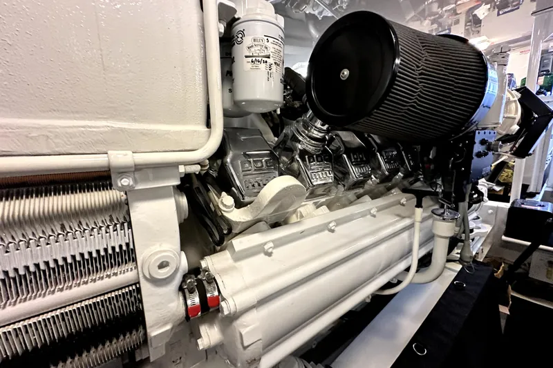 Reel Inn Yacht Photos Pics Engine room of a 2003 Viking 61 Convertible yacht, showcasing detailed machinery.