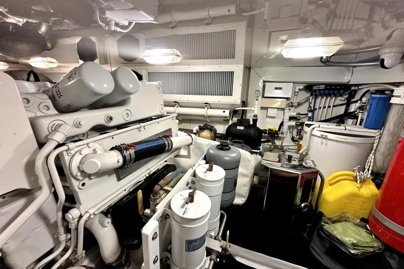 Reel Inn Yacht Photos Pics Engine room of a 2003 Viking 61 Convertible yacht, showcasing machinery and equipment.
