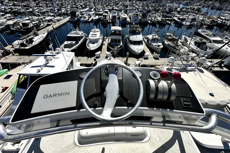 Reel Inn Yacht Photos Pics View from a 2003 Viking 61 Convertible yacht helm overlooking a busy marina.
