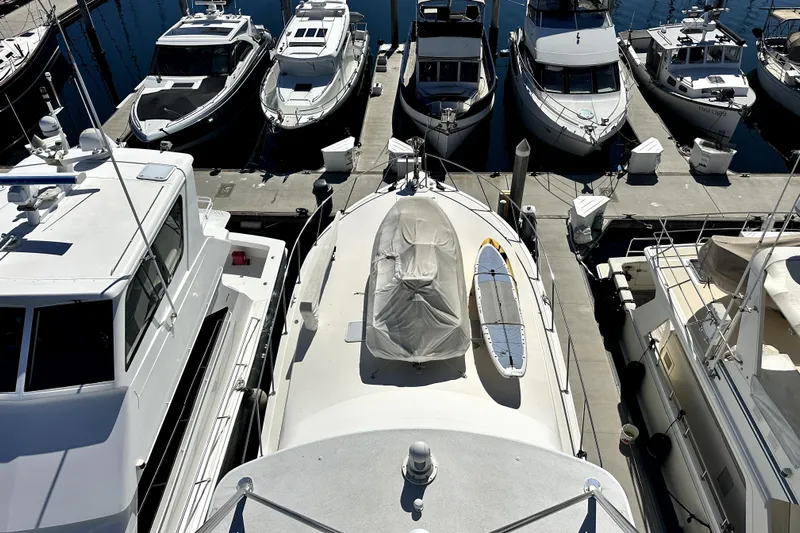 Reel Inn Yacht Photos Pics Overhead view of docked 2003 Viking 61 Convertible yacht among other boats.