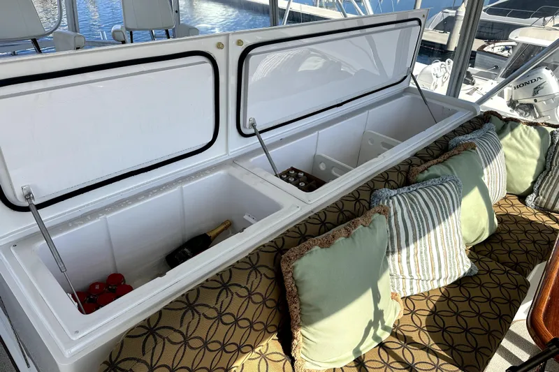 Reel Inn Yacht Photos Pics Open cooler with drinks and cushions on a 2003 Viking 61 Convertible yacht.