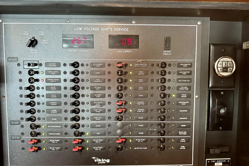 Reel Inn Yacht Photos Pics Control panel of a 2003 Viking 61 Convertible yacht, displaying battery voltage and load current.