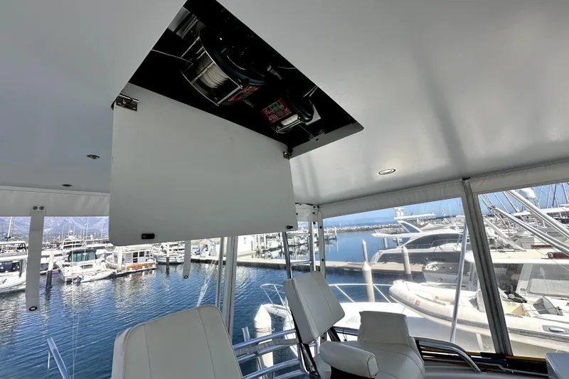 Reel Inn Yacht Photos Pics Interior view of 2003 Viking 61 Convertible yacht with marina backdrop.