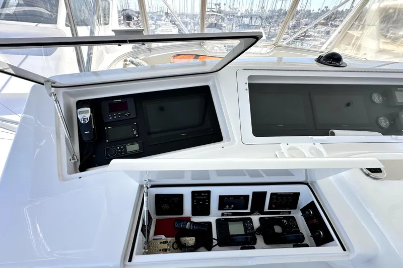 Reel Inn Yacht Photos Pics Control panel of a 2003 Viking 61 Convertible yacht with navigation and communication equipment.