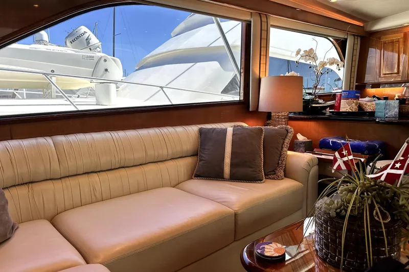 Reel Inn Yacht Photos Pics Luxurious interior of a 2003 Viking 61 Convertible yacht with plush seating and elegant decor.