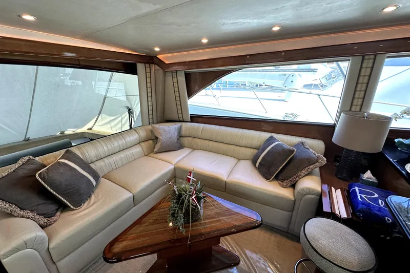 Reel Inn Yacht Photos Pics Luxurious interior of 2003 Viking 61 Convertible yacht with plush seating and elegant decor.