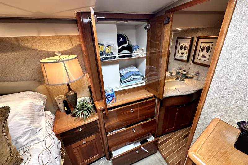 Reel Inn Yacht Photos Pics Luxurious cabin interior of a 2003 Viking 61 Convertible yacht with wooden cabinetry.