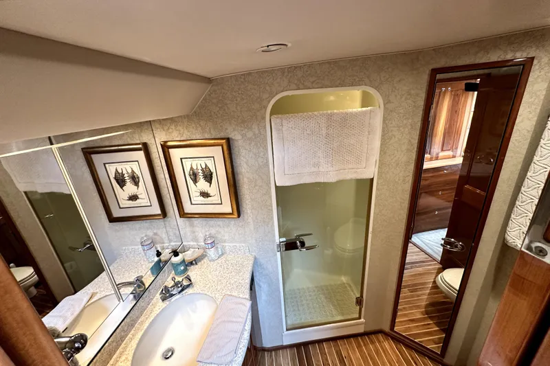 Reel Inn Yacht Photos Pics Bathroom interior of 2003 Viking 61 Convertible yacht with shower and sink.