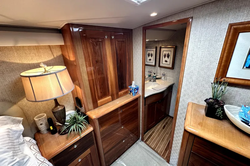 Reel Inn Yacht Photos Pics Luxurious interior of a 2003 Viking 61 Convertible yacht with elegant wood finishes.