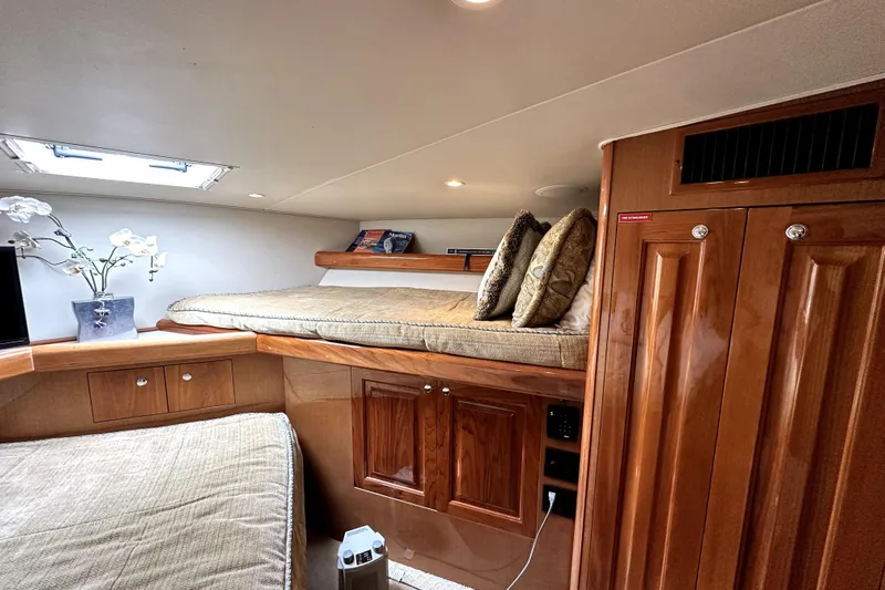 Reel Inn Yacht Photos Pics Luxurious cabin interior of 2003 Viking 61 Convertible yacht with elegant wood finish.