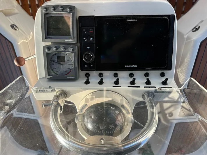 Pono Yacht Photos Pics Control panel of a 2006 Beneteau 423 sailboat with navigation instruments.