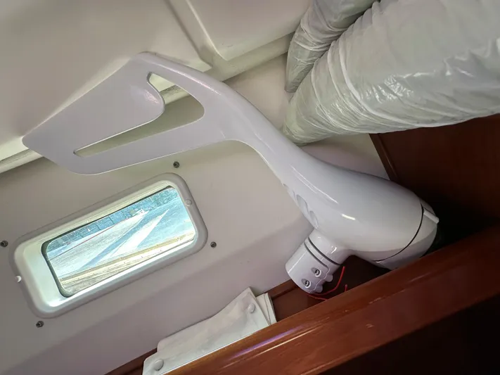 Pono Yacht Photos Pics Interior of 2006 Beneteau 423 yacht showing a fan and porthole window.