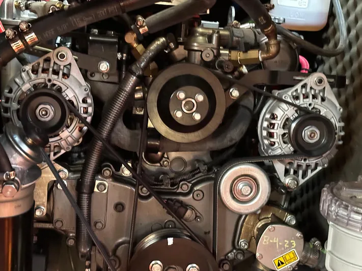 Pono Yacht Photos Pics Engine of a 2006 Beneteau 423 sailboat, showcasing mechanical components and belts.