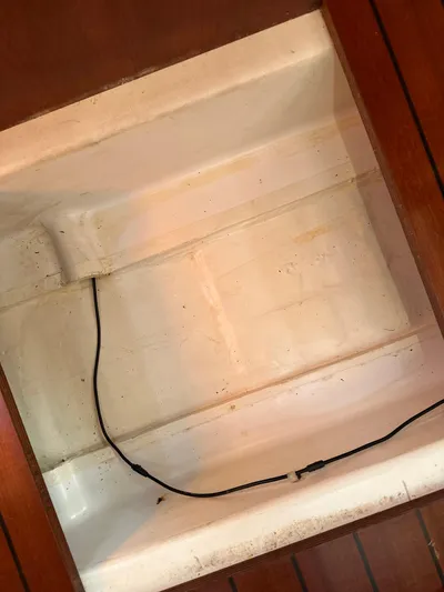 Pono Yacht Photos Pics Empty storage compartment in a 2006 Beneteau 423 sailboat interior.