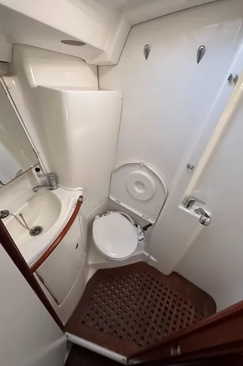 Pono Yacht Photos Pics Compact bathroom in a 2006 Beneteau 423 sailboat, featuring a sink and toilet.