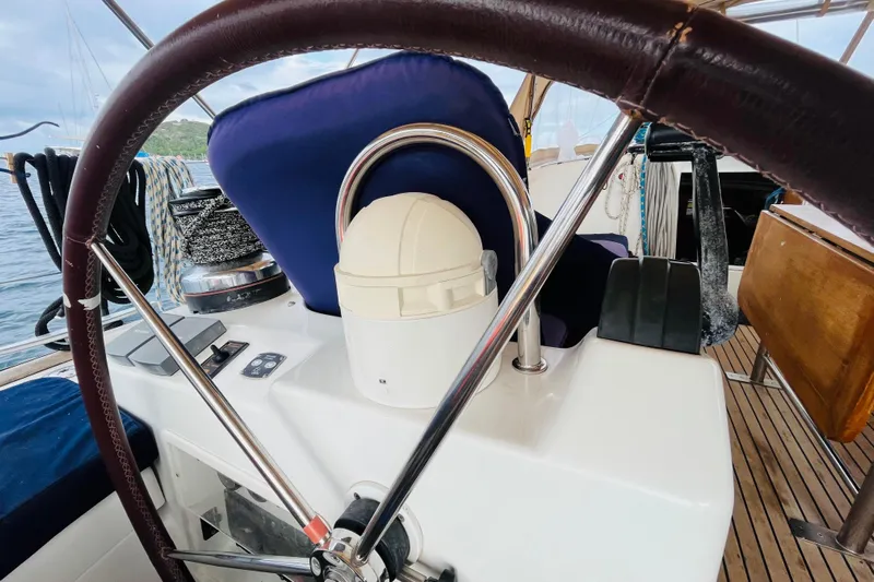  Yacht Photos Pics 2006 Beneteau 473 yacht cockpit with steering wheel and nautical equipment.