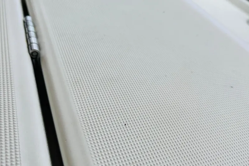  Yacht Photos Pics Close-up of textured surface and hinge on 2006 Beneteau 473 yacht.