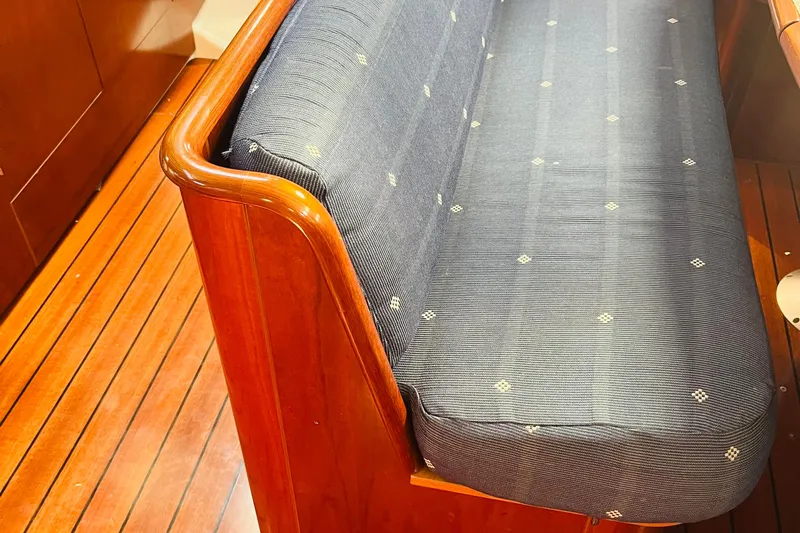  Yacht Photos Pics Wooden interior and cushioned seating of a 2006 Beneteau 473 yacht.