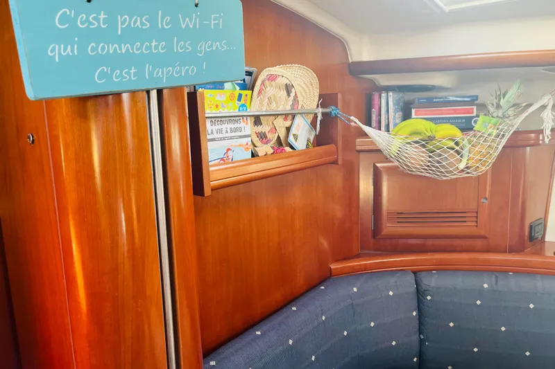  Yacht Photos Pics Interior of 2006 Beneteau 473 sailboat with fruit hammock and French sign.