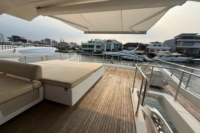  Yacht Photos Pics Luxurious 2014 Azimut 80 yacht deck with sunbed, overlooking marina and waterfront homes.