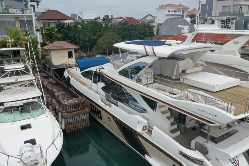  Yacht Photos Pics Luxury 2014 Azimut 80 yacht docked in a marina, surrounded by other boats.