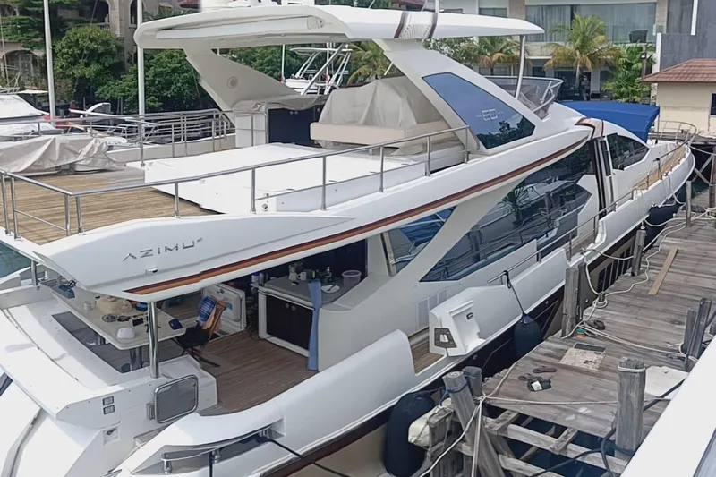 Yacht Photos Pics Luxury 2014 Azimut 80 yacht docked at marina, featuring sleek design and spacious deck.