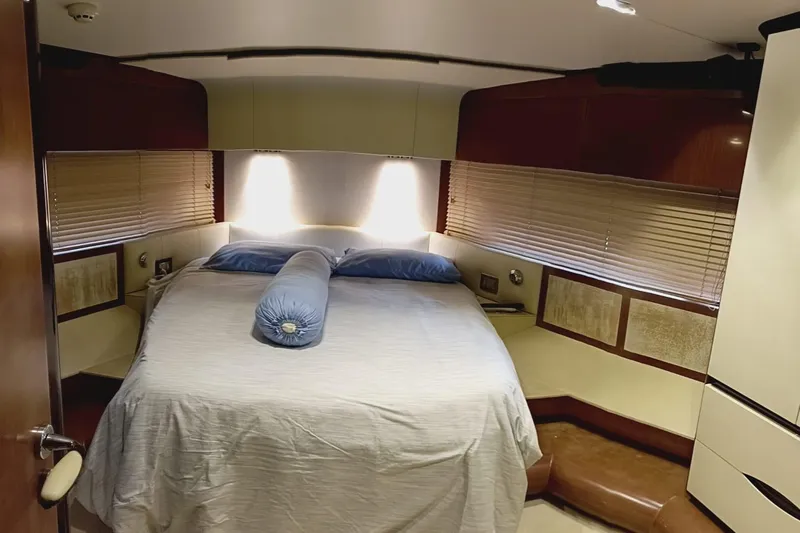  Yacht Photos Pics Luxurious bedroom interior of 2014 Azimut 80 yacht with elegant bedding and ambient lighting.