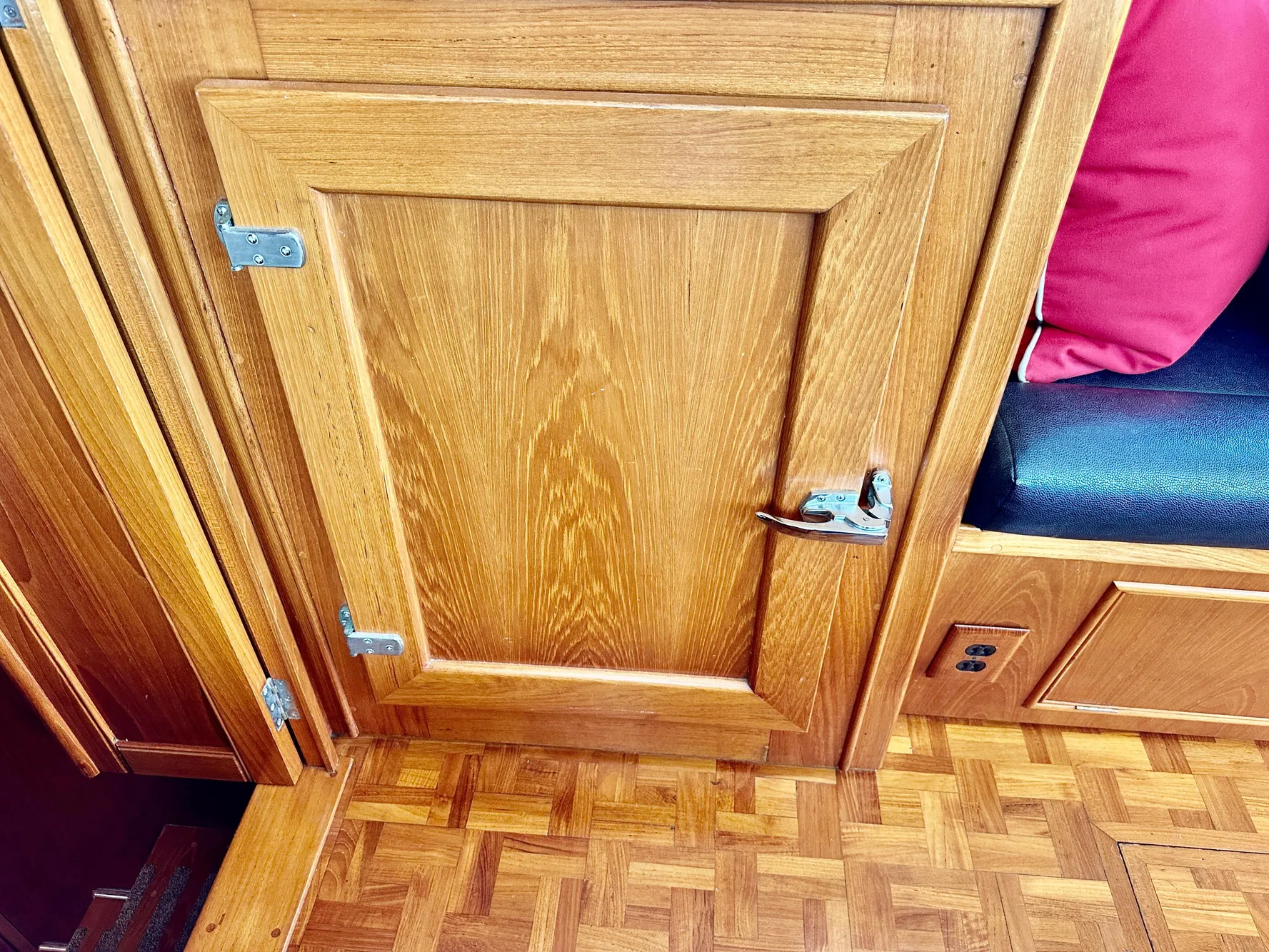 Wooden interior of 1989 Grand Banks 42 Classic yacht with parquet flooring.
