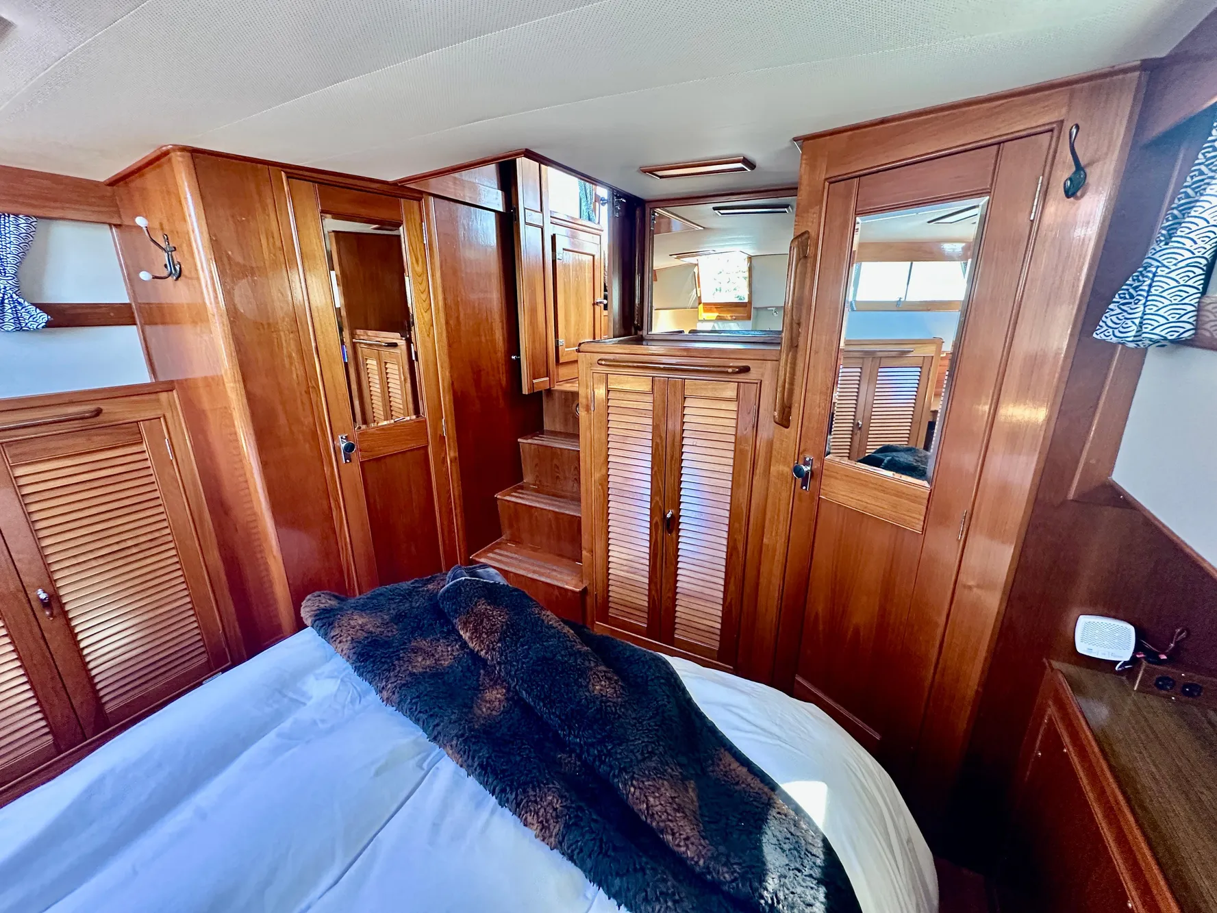 Luxurious wood interior of 1989 Grand Banks 42 Classic yacht cabin.