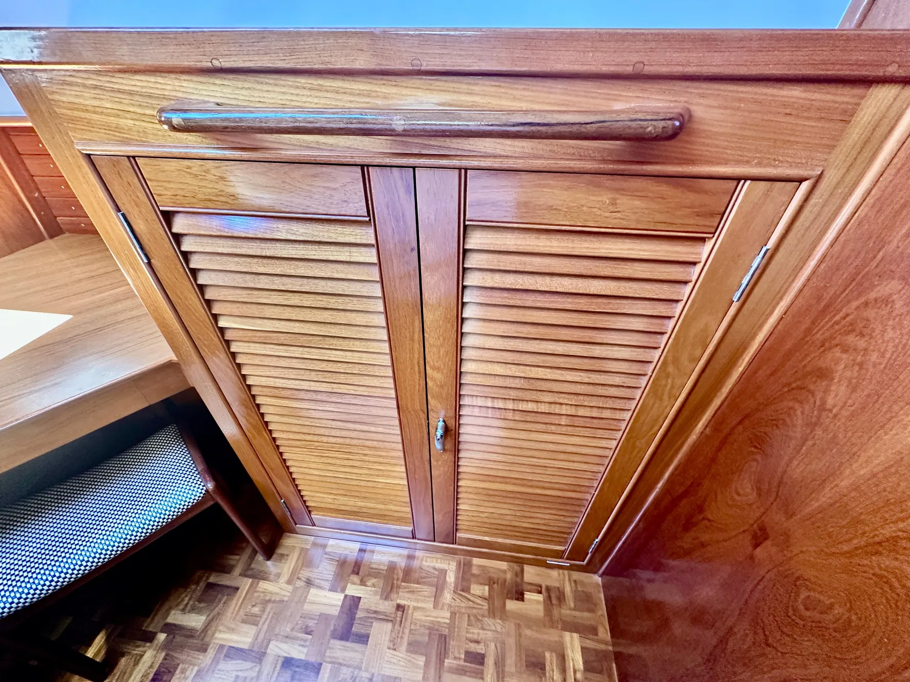 Wooden cabinet doors on 1989 Grand Banks 42 Classic yacht interior.