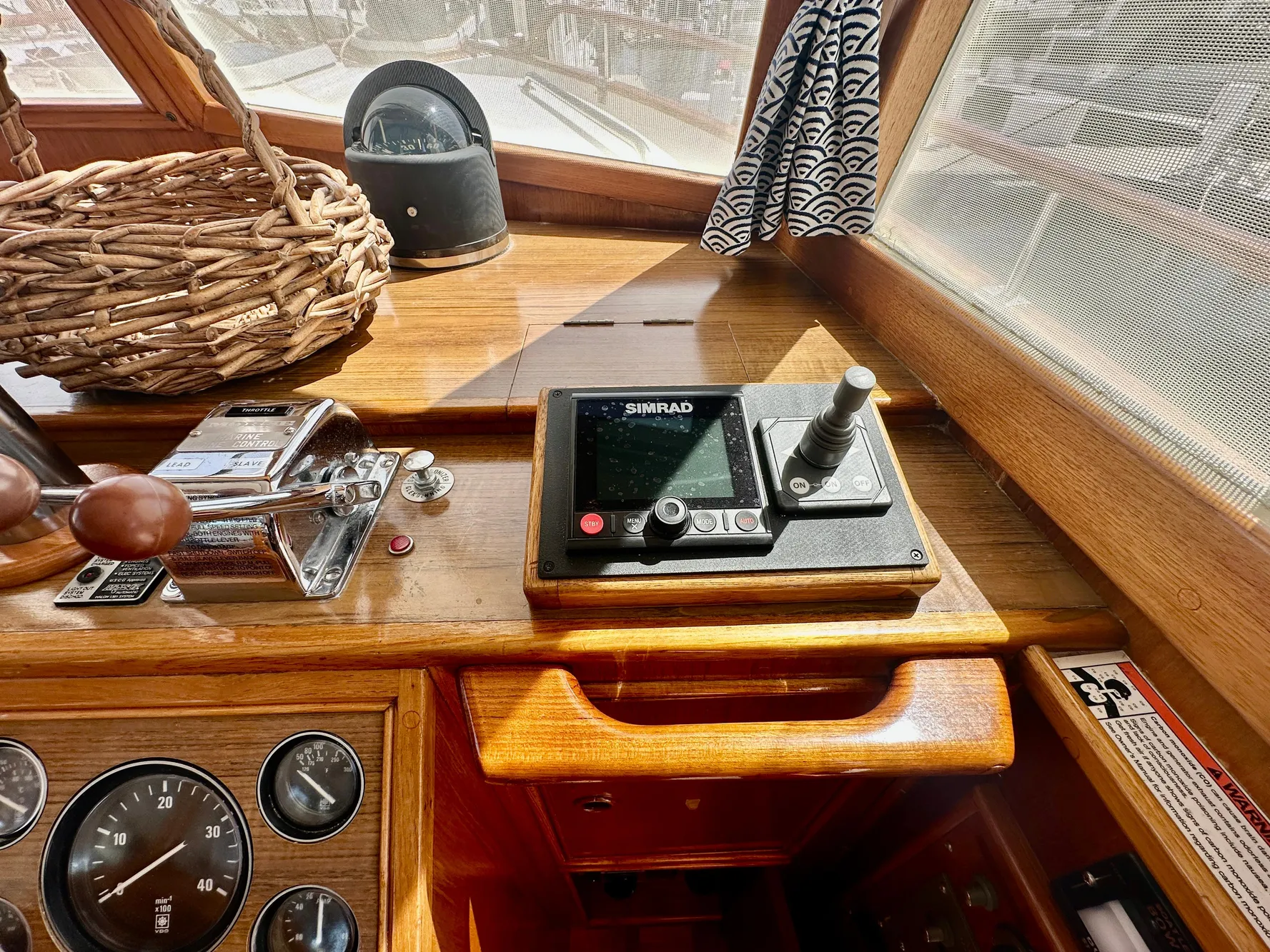 Control panel of a 1989 Grand Banks 42 Classic yacht with navigation equipment.