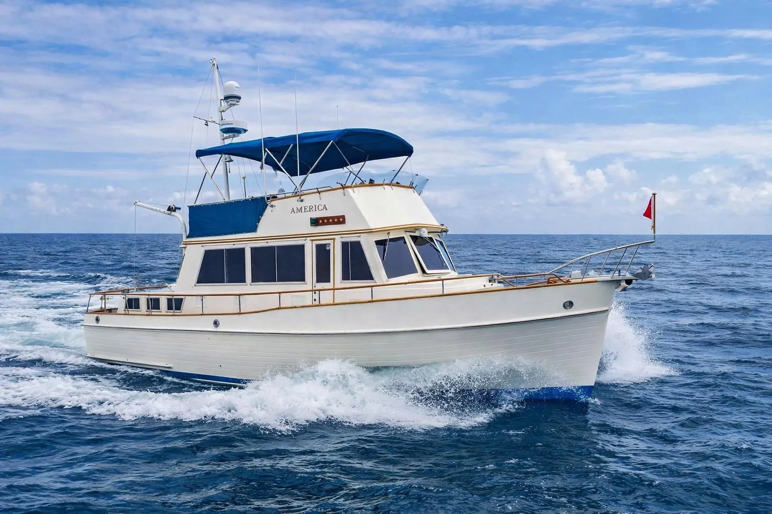 1989 Grand Banks 42 Classic yacht cruising on open sea under clear skies.