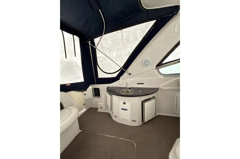  Yacht Photos Pics Interior of 2007 Four Winns 378 Vista boat with kitchenette and seating area.