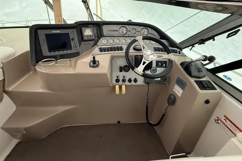  Yacht Photos Pics 2007 Four Winns 378 Vista boat helm with steering wheel and navigation controls.