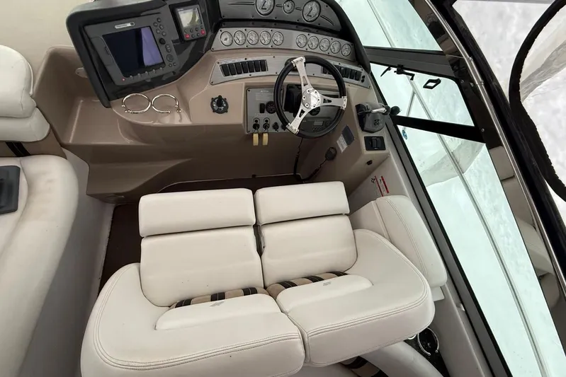  Yacht Photos Pics 2007 Four Winns 378 Vista boat cockpit with steering wheel and control panel.