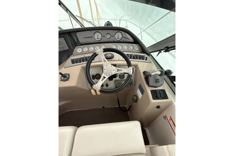  Yacht Photos Pics 2007 Four Winns 378 Vista helm with steering wheel and control panel.