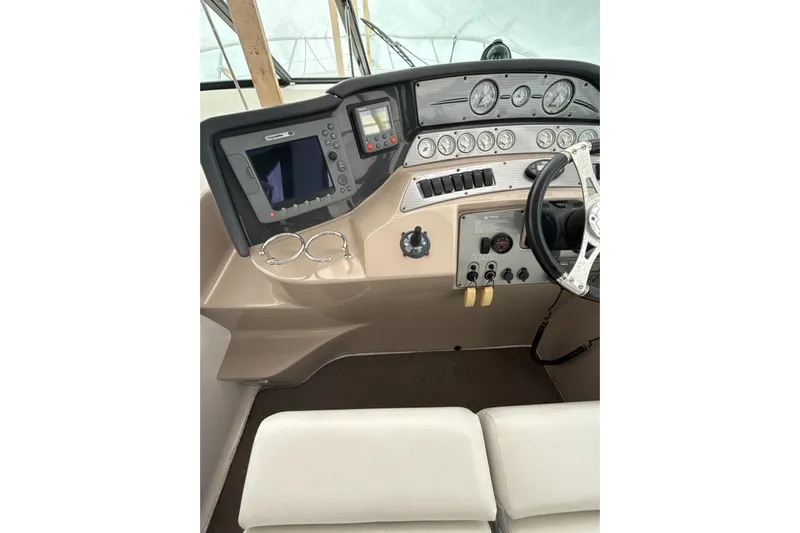  Yacht Photos Pics 2007 Four Winns 378 Vista boat dashboard with steering wheel and navigation controls.